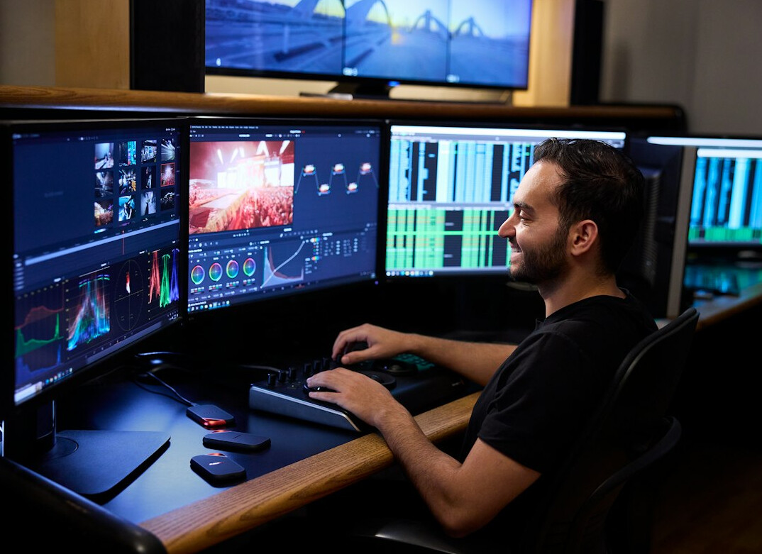 Production team reviewing live feeds on multiple monitors